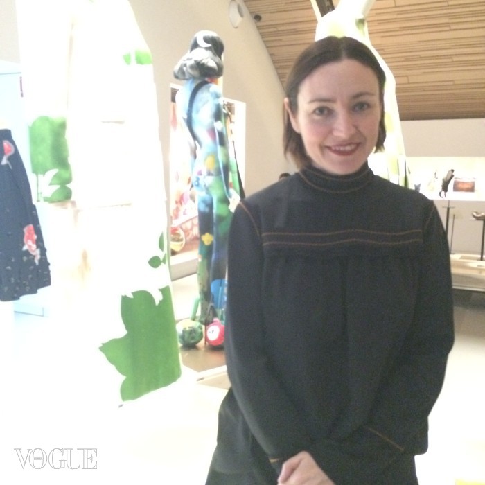 Judith Clark, curator of the Louis Vuitton exhibition, in front of an LV fashion display