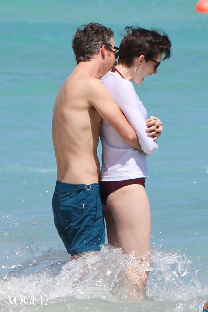 Anne Hathaway shares a tender embrace with Adam Shulman
