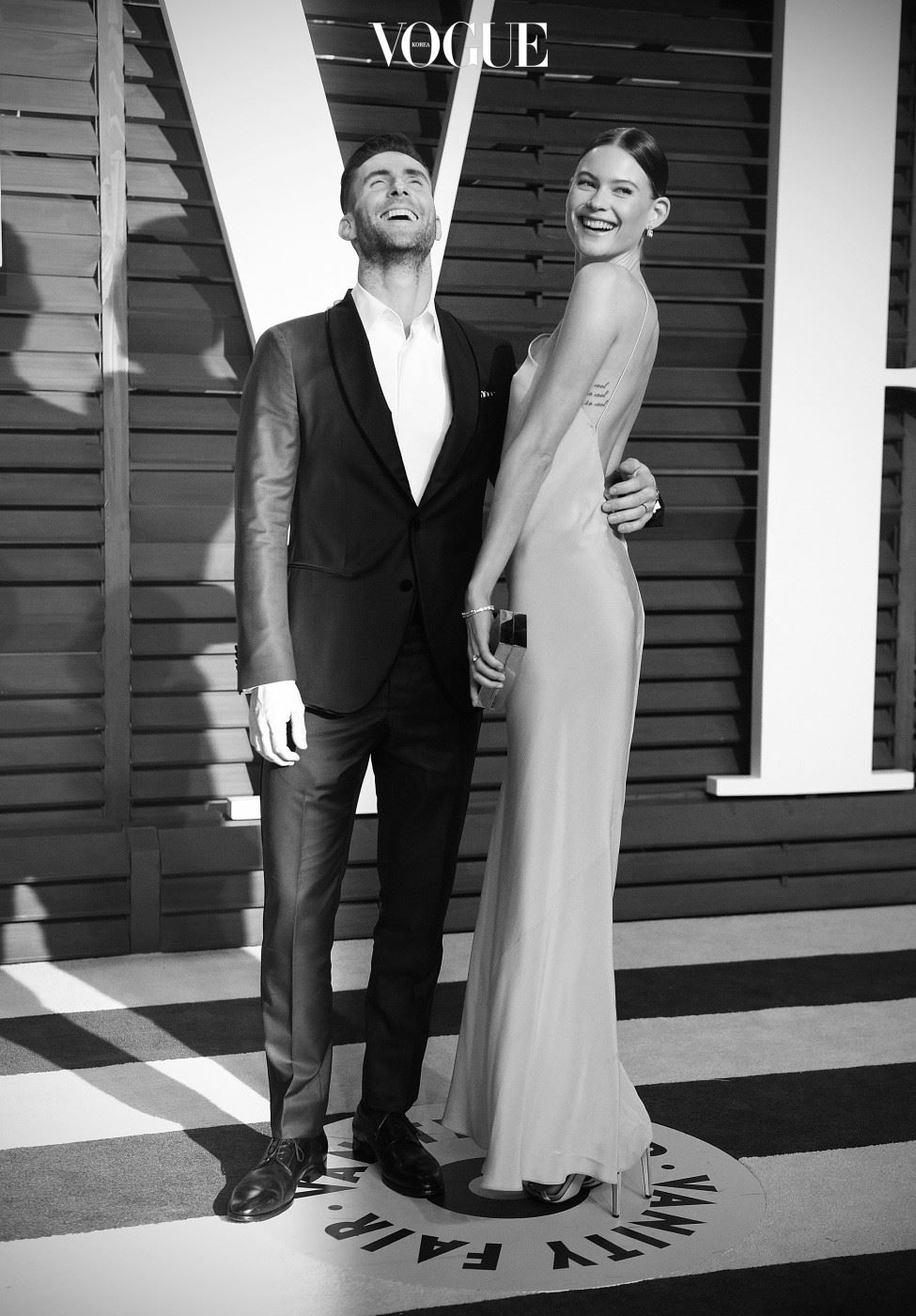 BEVERLY HILLS, CA - FEBRUARY 22:  ( Editors Note: Image processed using digital filters )  Singer Adam Levine and wife Behati Prinsloo attend the 2015 Vanity Fair Oscar Party at Wallis Annenberg Center for the Performing Arts on February 22, 2015 in Beverly Hills, California.  (Photo by Jason Kempin/Getty Images)