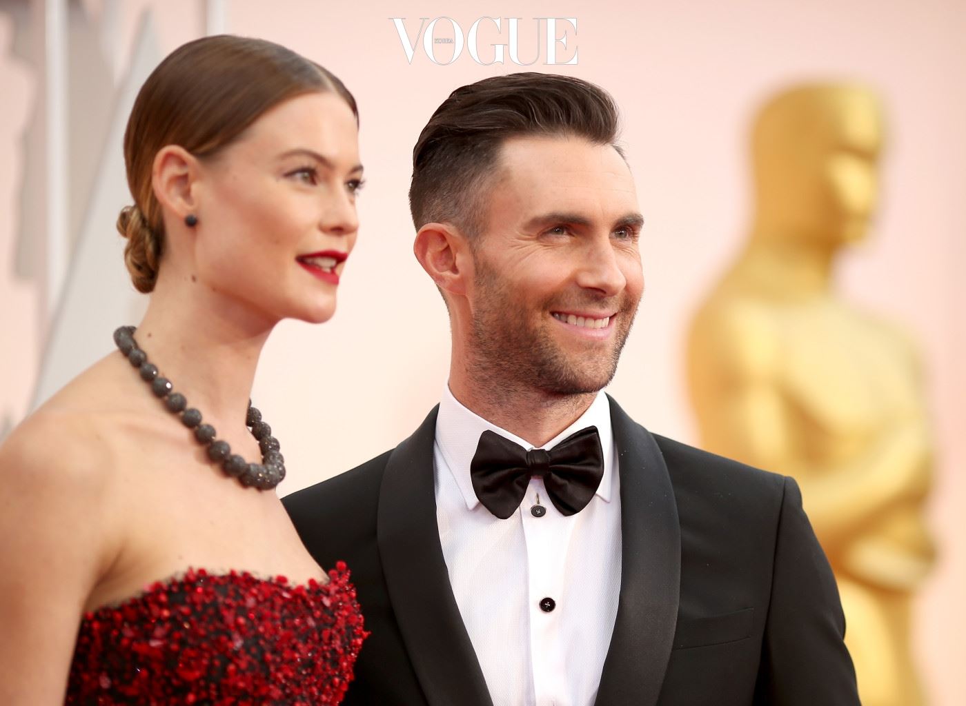 HOLLYWOOD, CA - FEBRUARY 22: Recording artist Adam Levine (R) and model Behati Prinsloo attend the 87th Annual Academy Awards at Hollywood & Highland Center on February 22, 2015 in Hollywood, California.  (Photo by Christopher Polk/Getty Images)