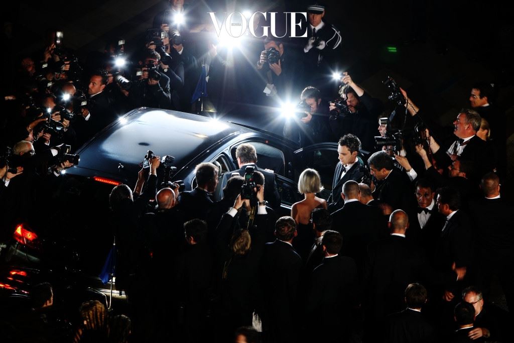 CANNES, FRANCE - MAY 17:  Photographers surround the car as Johnny Hallyday departs the Vengeance Premiere at the Palais Des Festivals during the 62nd International Cannes Film Festival on May 17, 2009 in Cannes, France.  (Photo by Georges De Keerle/Getty Images)