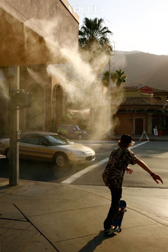 PALM SPRINGS, CA - JULY 5:  A boy rides a skateboard past a sidewalk cafe mister as temperatures hovers around 115 degrees Fahrenheit July 5, 2007 in Palm Springs, California. The first major heat wave of the summer is gripping the Southwest this week as parts of southern California experience the driest year on record.  (Photo by David McNew/Getty Images)