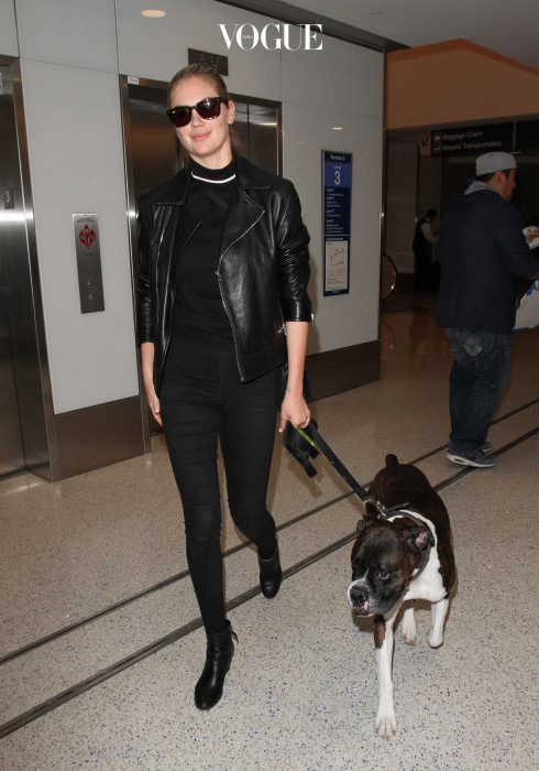 Kate Upton is all smiles as she arrives in LA with her adorable Boxer dog.  The supermodel was seen in all black at LAX in black pants, black ankle boots, a black leather jacket & a black blouse. Pictured: Kate Upton Ref: SPL1264626  130416   Picture by: Sharky Splash News and Pictures Los Angeles:310-821-2666 New York:212-619-2666 London:870-934-2666 photodesk@splashnews.com 