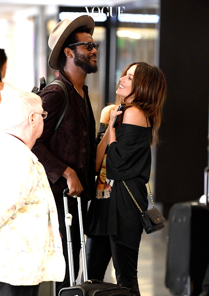 EXCLUSIVE: **EXCLUSIVE**  Photo Credit: MOVI Inc.  Date: September 26th 2016 Sporting a Rihanna t-shirt Australian model Nicole Trunfio gets a cuddle from her rocker husband Gary Clark Jr as the pair touch down at the Los Angeles International airport. NO DAILY MAIL ONLINE Pictured: Nicole Trunfio, Gary Clark Jr Ref: SPL1377704  201016   EXCLUSIVE Picture by: MOVI Inc. / Splash News Splash News and Pictures Los Angeles:310-821-2666 New York: 212-619-2666 London:870-934-2666 photodesk@splashnews.com 