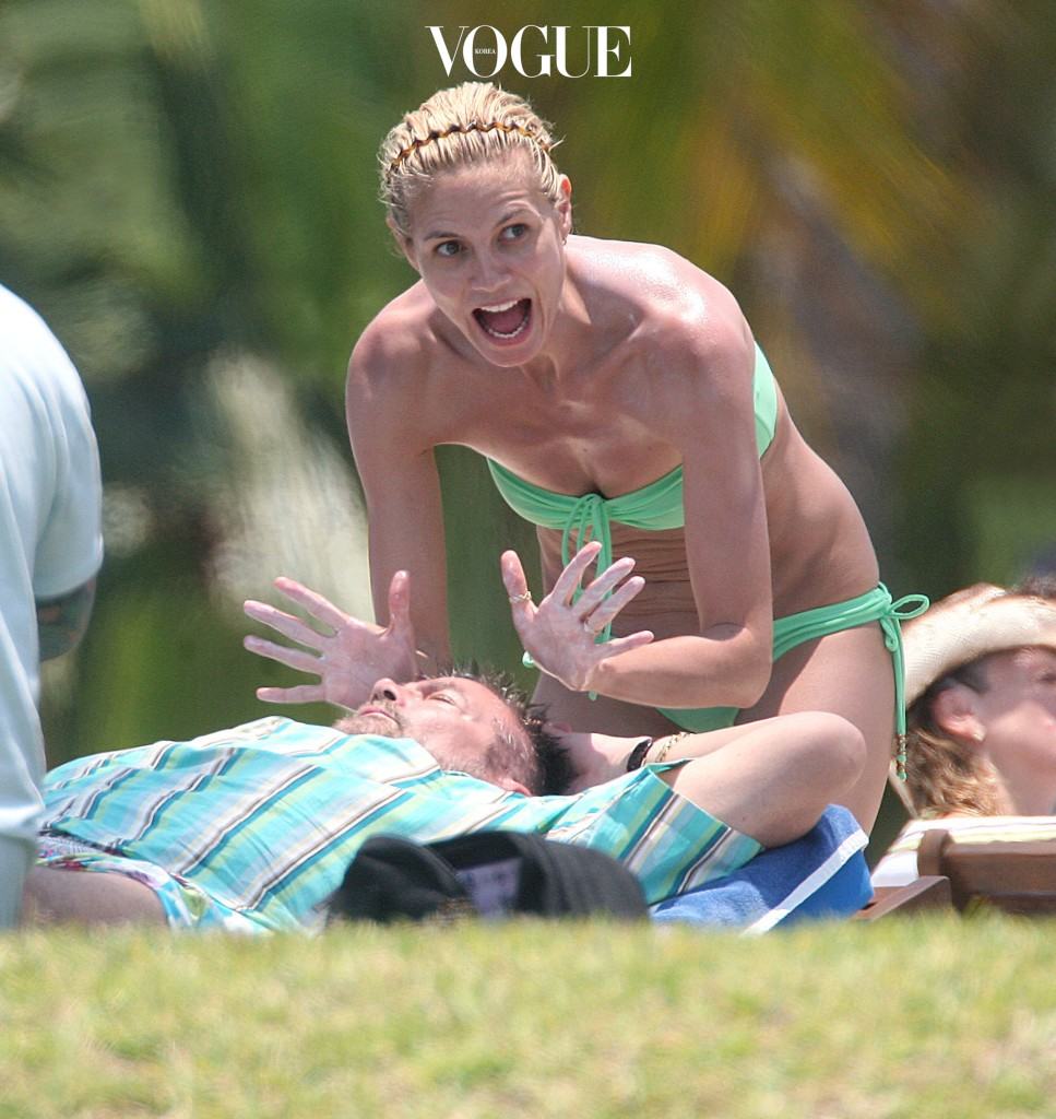 Supermodel Heidi Klum has some fun in the sun with her family on vacation in Mexico. Sporting a green bikini and bright green straw hat the 'Project Runway' host spent the day laughing,joking and taking pictures in the sun with her parents Gunther and Erna and kids Leni, Johan and Henry. Husband Seal is due to join the family soon as the couple prepare to renew their wedding vows and their nearby cliff top retreat.  Pictured: Heidi Klum Ref: SPL30420  080508   EXCLUSIVE Picture by: Vickers/Seligman/Splash News Splash News and Pictures Los Angeles: 310-821-2666 New York: 212-619-2666 London: 870-934-2666 photodesk@splashnews.com 