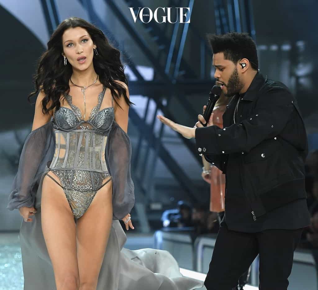 PARIS, FRANCE - NOVEMBER 30:  Bella Hadid walks the runway as The Weekend performs during the 2016 Victoria's Secret Fashion Show on November 30, 2016 in Paris, France.  (Photo by Dimitrios Kambouris/Getty Images for Victoria's Secret)