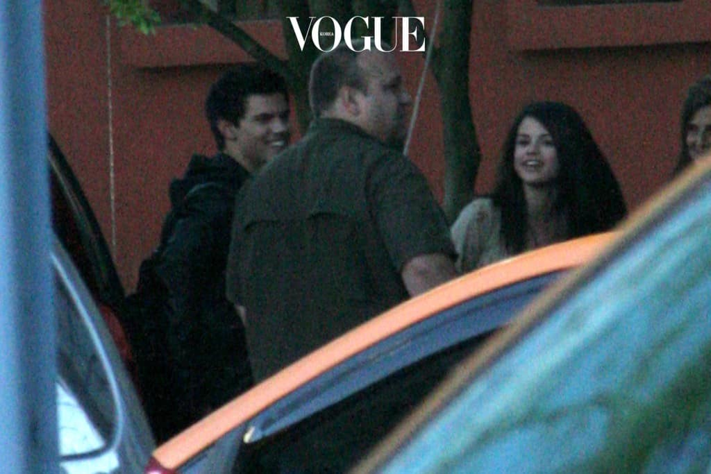 Selena Gomez hugs Taylor Lautner's dad as they head out for dinner, Vancouver. Pictured: Selena Gomez, Daniel and Taylor Lautner Ref: SPL100012 120509  Picture by: Splash News Splash News and Pictures Los Angeles: 310-821-2666 New York: 212-619-2666 London: 870-934-2666 photodesk@splashnews.com 