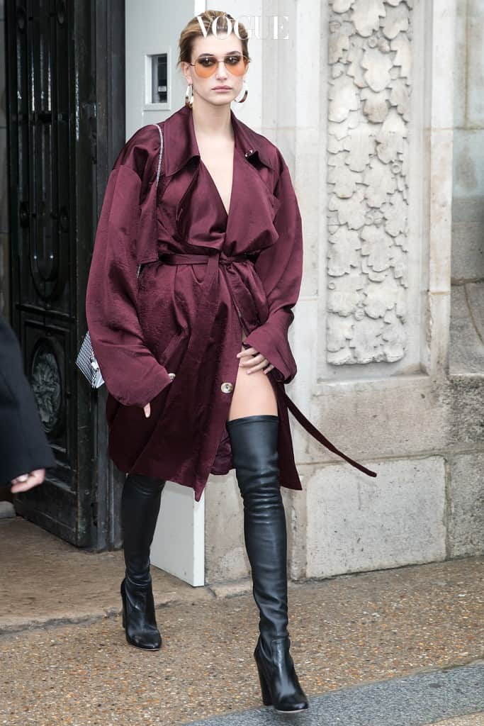 Hailey Baldwin seen leaving Elie Saab show during Paris Fashion Week in Paris, France wearing just a maroon trench coat and thigh high boots. Pictured: Hailey Baldwin Ref: SPL1456075  040317   Picture by: Splash News Splash News and Pictures Los Angeles:310-821-2666 New York:212-619-2666 London:870-934-2666 photodesk@splashnews.com 