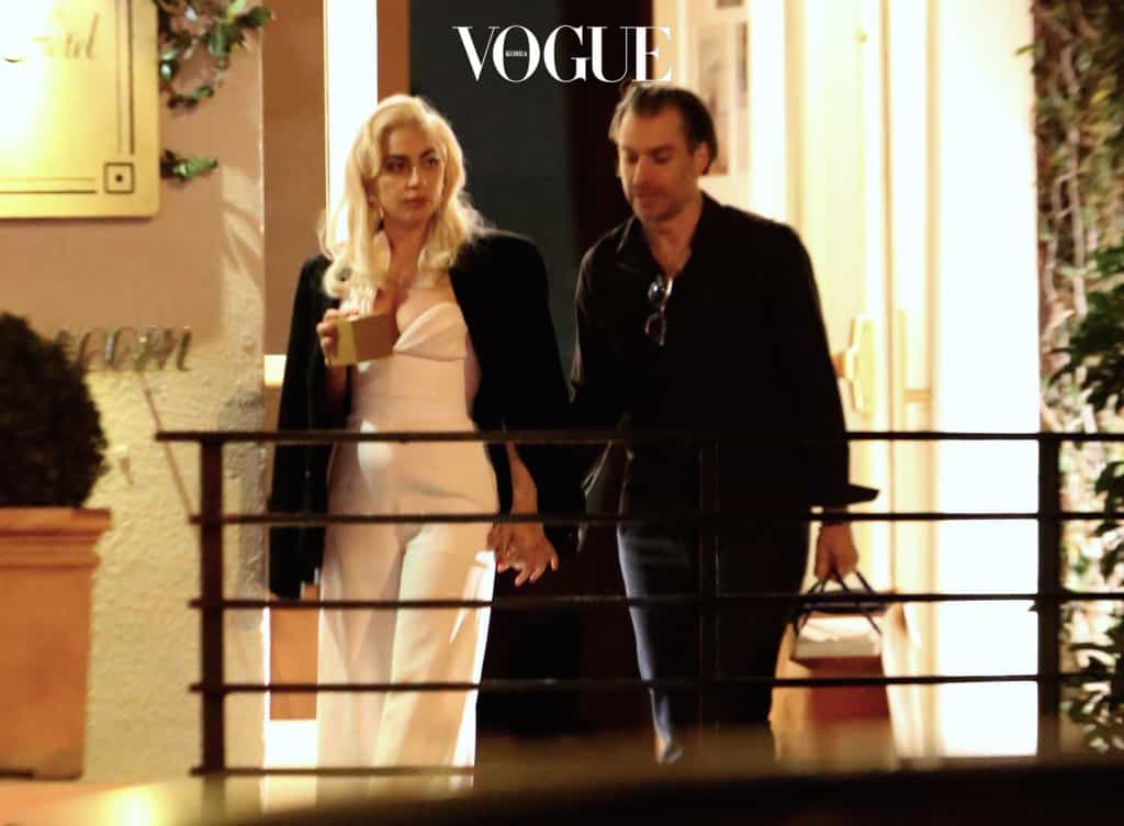 EXCLUSIVE: *PREMIUM EXCLUSIVE RATES APPLY* *NO WEB UNTIL 1PM PST, MARCH 7, 2017* Lady Gaga gets intimate with her new romance and manager Christian Carino as they leave a celebrity-packed party at the Sunset Tower Hotel in West Hollywood. The loved up couple were the last to leave the party, holding hands as they emerged at about 4am. Gaga had Christian's jacket draped around her as they kissed passionately while waiting at the valet. Other stars at the party included  Lilly Collns, Jessica Alba, Dylan Mcdermott, Tommy Hilfiger, and Christina Aguilera Pictured: Lady Gaga Ref: SPL1456795  060317   EXCLUSIVE Picture by: Splash Splash News and Pictures Los Angeles:310-821-2666 New York:212-619-2666 London: 870-934-2666 photodesk@splashnews.com 