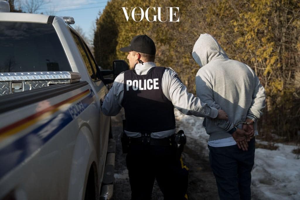 HEMMINGFORD, QUEBEC - FEBRUARY 22: A man claiming to be from Sudan is apprehended by Royal Canadian Mounted Police officers after he crossed the U.S.-Canada border into Canada, February 22, 2017 in Hemmingford, Quebec. In the past month, hundreds of people have crossed Quebec land border crossings in attempts to seek asylum and claim refugee status in Canada. (Photo by Drew Angerer/Getty Images)