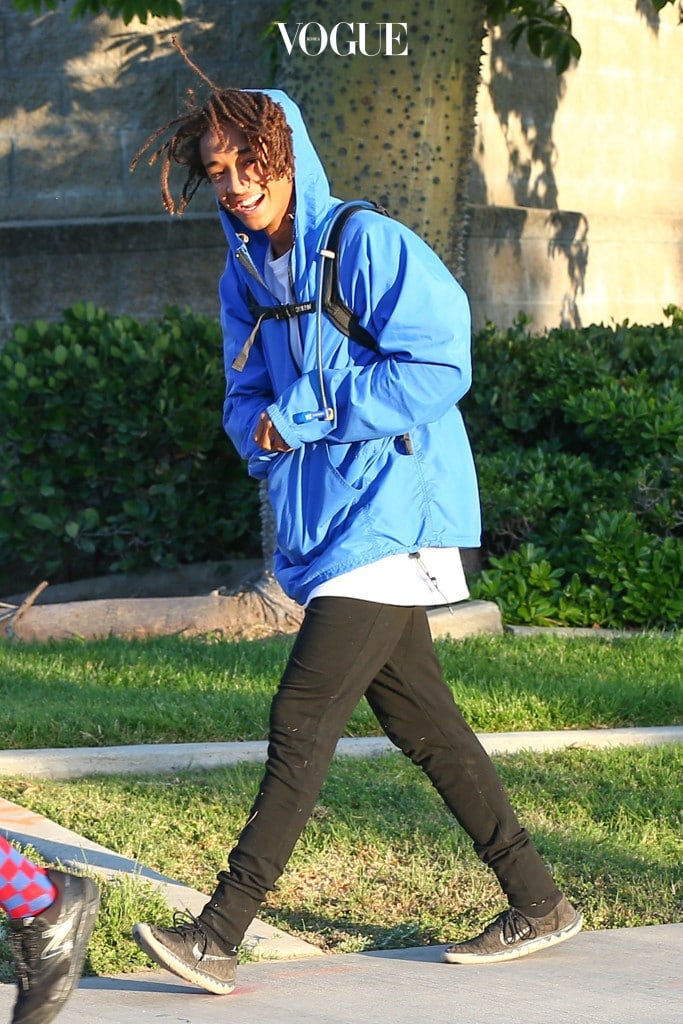 UK CLIENTS MUST CREDIT: AKM-GSI ONLY EXCLUSIVE: Singer, Jaden Smith, was in a great spirits when he was spotted walking with a couple of friends. The usually camera shy actor originally hid from the camera but quickly changed his mind and gave a peace sign and a bright smile as he walked. Pictured: Jaden Smith Ref: SPL1039569  290515   EXCLUSIVE Picture by: AKM-GSI / Splash News 