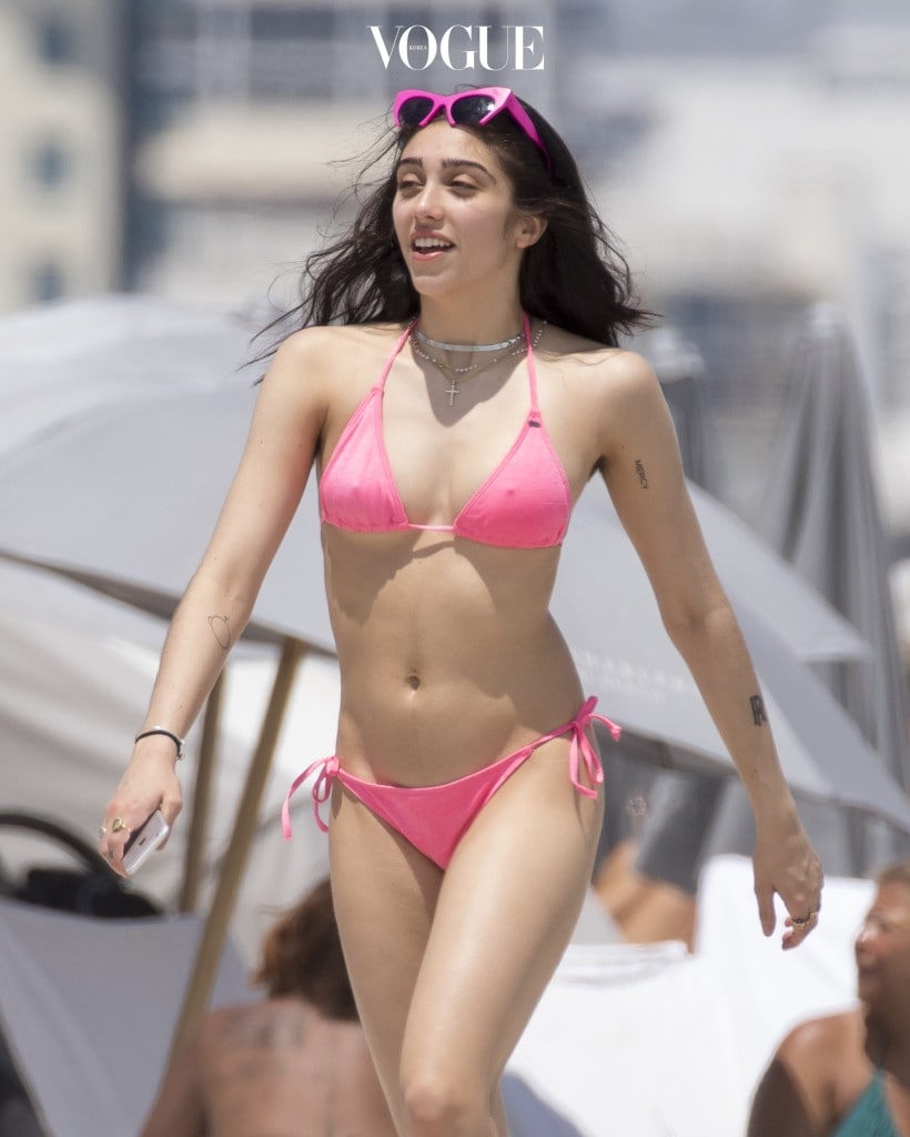 EXCLUSIVE: **PREMIUM EXCLUSIVE RATES APPLY***Madonna's daughter Lourdes Leon shows off her bikini body on the beach in Miami. Lourdes met up with Madonna's ex-lover Ingrid Casaras for a Sunday afternoon at the beach with friends. The 20-year-old sported a pink bikini with matching pink shades on her head, unshaved armpits and a nose ring. Also several tattoos where on display as she had a play fight with one of her friends. Pictured: Lourdes Leon Ref: SPL1476891  100417   EXCLUSIVE Picture by: Splash News Splash News and Pictures Los Angeles:310-821-2666 New York:212-619-2666 London:870-934-2666 photodesk@splashnews.com 