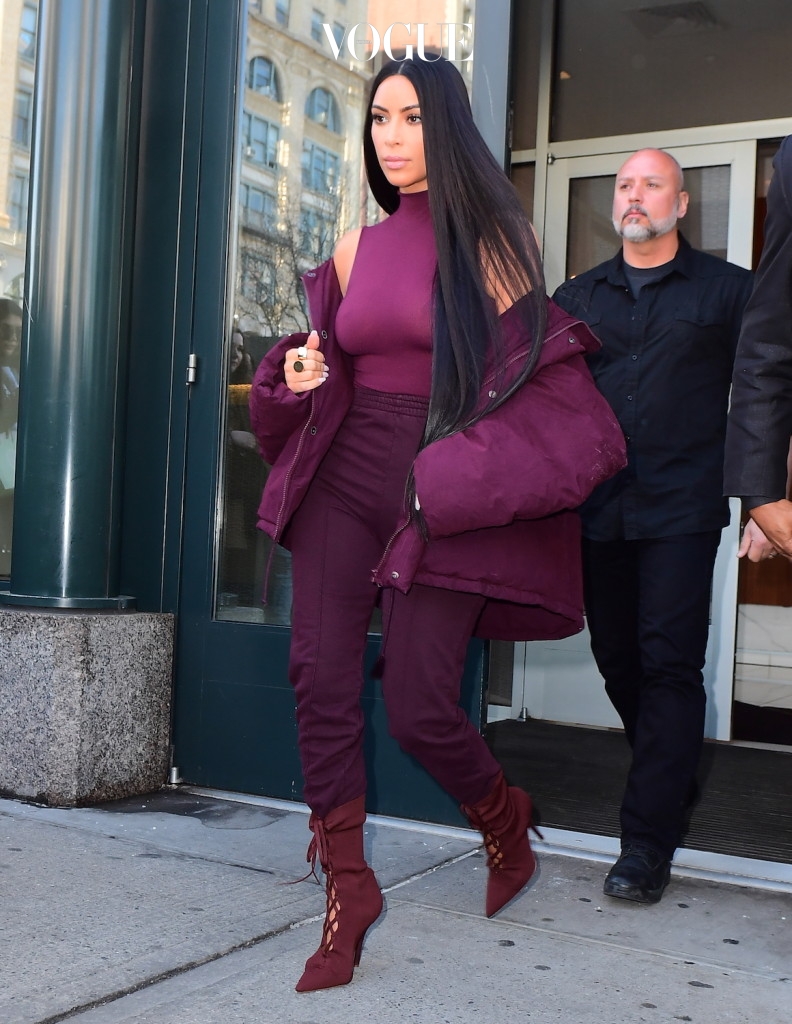 Kim Kardashian didn't take any chances as she headed to her husband. Kanye West's Fashion Show in NYC on Wednesday. Kim was flanked by security guards on all side as she left her Soho Apartment, while wearing a tight fitting Maroon Outfit . Her outfit seemed very put together, but her Jacket appeared dirty and had stains on it. Kylie Jenner and Tyga also left for the show , at Chelsea Piers  Pictured: Kim Kardashian Ref: SPL1443459  150217   Picture by: 247PAPS.TV / Splash News Splash News and Pictures Los Angeles:310-821-2666 New York:212-619-2666 London:870-934-2666 photodesk@splashnews.com 