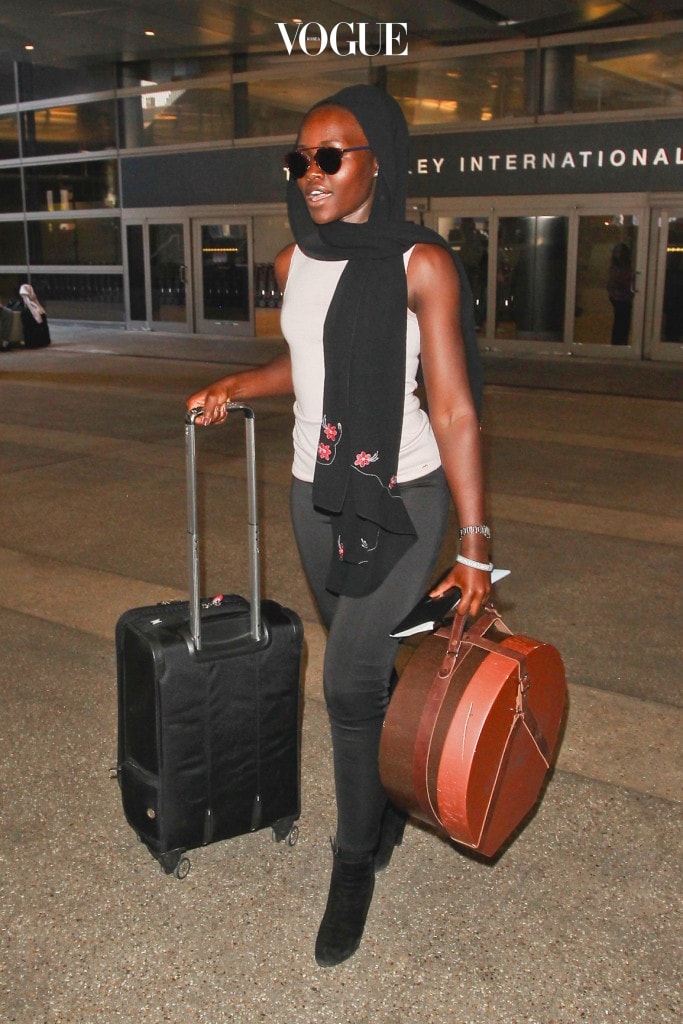 ***MANDATORY BYLINE TO READ INFPhoto.com ONLY*** Lupita Nyong'o at LAX Airport, Los Angeles, CA. Pictured: Lupita Nyong'o Ref: SPL1078581  130715   Picture by: INFphoto.com 