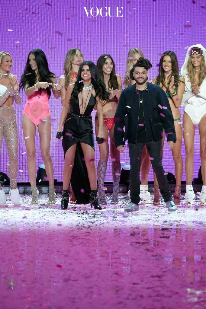 NEW YORK, NY - NOVEMBER 10: (back row L-R) Candice Swanepoel, Adriana Lima, Behati Prinsloo, Lily Aldridge, Romee Strijd, Alessandra Ambrosio, Kate Grigorieva, (Front Row L-R) Singer Selena Gomez, and Singer The Weeknd walk the runway during the 2015 Victoria's Secret Fashion Show at Lexington Avenue Armory on November 10, 2015 in New York City.  (Photo by Jamie McCarthy/Getty Images)