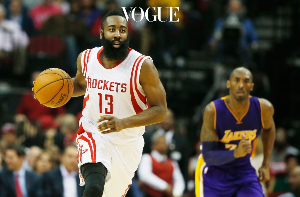 HOUSTON, TX - NOVEMBER 19:  James Harden #13 of the Houston Rockets takes the ball upcourt in front of Kobe Bryant #24 of the Los Angeles Lakers during their game at the Toyota Center on November 19, 2014 in Houston, Texas.  NOTE TO USER: User expressly acknowledges and agrees that, by downloading and/or using this photograph, user is consenting to the terms and conditions of the Getty Images License Agreement.  (Photo by Scott Halleran/Getty Images)