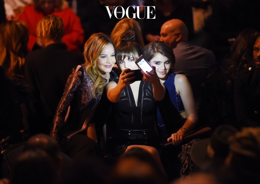 NEW YORK, NY - FEBRUARY 11:  Actresses Abbie Cornish, Bailee Madison and Sami Gayle take a selfie as they attend the front row at the BCBGMAXAZRIA Fall 2016 show during New York Fashion Week at The Arc, Skylight at Moynihan Station on February 11, 2016 in New York City.  (Photo by Nicholas Hunt/Getty Images)