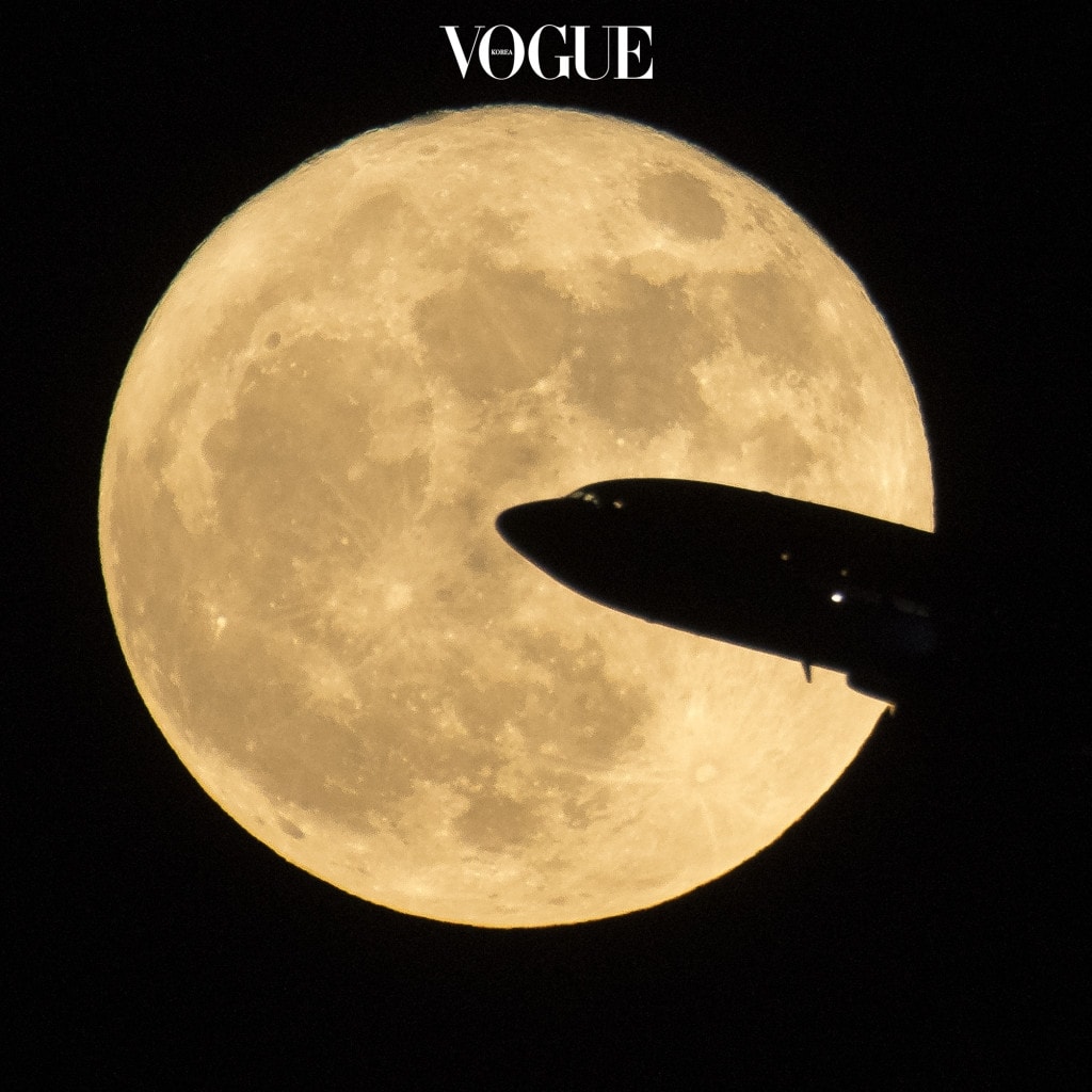 WASHINGTON, DC - DECEMBER 3: In this handout provided by NASA, an aircraft taking off from Ronald Reagan National Airport is seen passing in front of the moon as it rises on December 3, 2017 in Washington, DC.  Today's full Moon is the first of three consecutive supermoons. The two will occur on Jan. 1 and Jan. 31, 2018. A supermoon occurs when the moon's orbit is closest (perigee) to Earth at the same time it is full. (Photo by NASA/Bill Ingalls via Getty Images)
