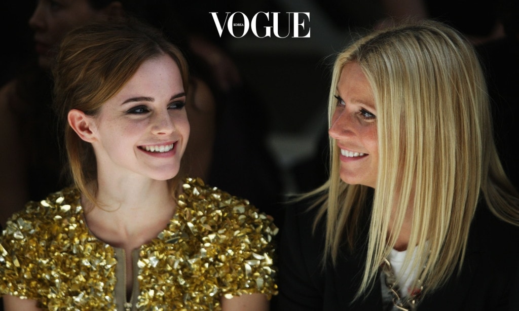 LONDON, ENGLAND - SEPTEMBER 22: Emma Watson and Gwyneth Paltrow dressed in Burberry watch the Burberry Prorsum Spring/Summer 2010 Show at Rootstein Hopkins Parade Ground during London Fashion Week on September 22, 2009 in London, England.  (Photo by Chris Jackson/Getty Images)