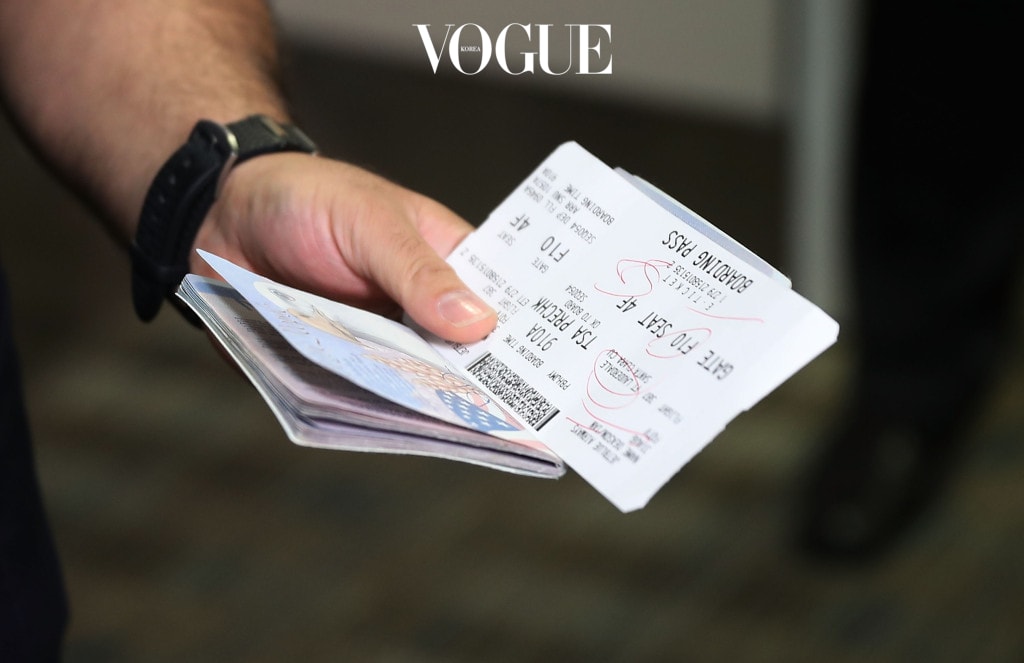 FORT LAUDERDALE, FL - AUGUST 31: A passenger holds his passport and ticket at the Fort Lauderdale-Hollywood International Airport as he checks in for JetBlue Flight 387 the first scheduled commercial flight to Cuba since 1961 on August 31, 2016 in Fort Lauderdale, Florida. JetBlue which hopes to have as many as 110 daily flights is the first U.S. airline to resume regularly scheduled airline service under new rules allowing Americans greater access to Cuba.  (Photo by Joe Raedle/Getty Images)